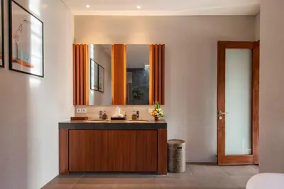 a bathroom with a sink and a mirror at Villa Sally in Canggu