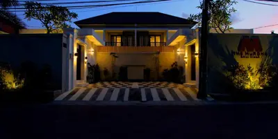 a house at night with the lights on at The Murdha Villa in Seminyak