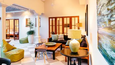 a living room with a couch and a table at Villa Mandala in Seminyak