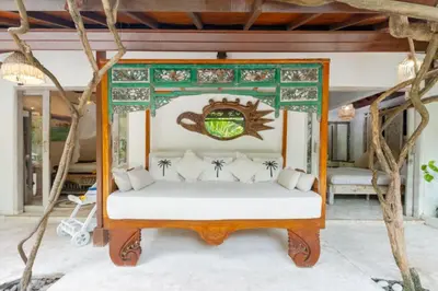 a bed in the middle of a room at Ocean Star 5 in Seminyak