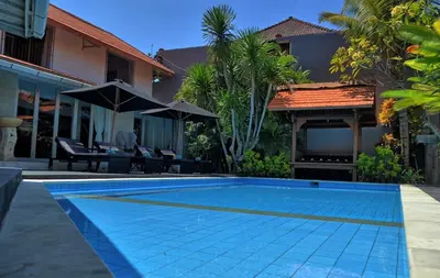 a swimming pool in the backyard of a villa at Grange Villa - Legian in Legian