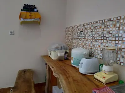 a kitchen counter with appliances on top of it at Beji Ayu Homestay in Seminyak