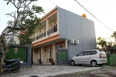 a white van parked in front of a building at Beji Ayu Homestay in Seminyak