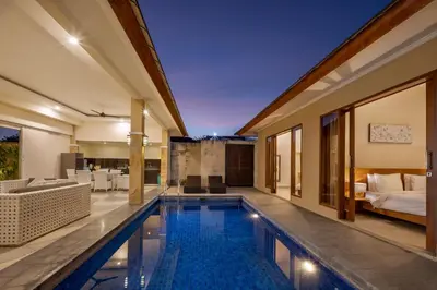 a swimming pool in a villa with a bedroom at Villa Destino - Seminyak Bali in Seminyak