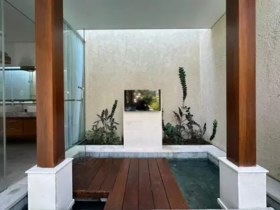 a room with a pool of water in a house at Sithala Villa Seminyak in Seminyak
