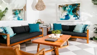 a living room with two couches and a coffee table at Villa Wahah in Seminyak