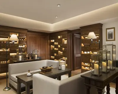a living room with a couch and a wine cellar at Hotel Indigo Bali Seminyak Beach by IHG in Seminyak