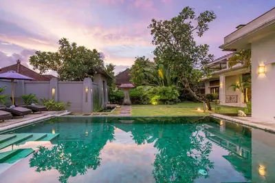 a swimming pool in the backyard of a house at Bali Villa Lotus in Seminyak