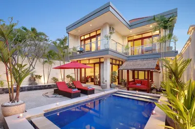 an image of a house with a swimming pool at Villa Nova in Legian