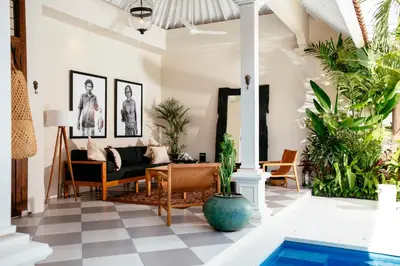 a living room with a black and white checkered floor at Villa Tsuchi in Seminyak