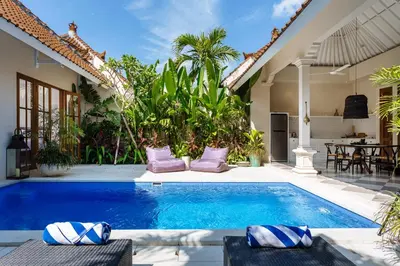 a swimming pool in the backyard of a house at Villa Alliv in Seminyak