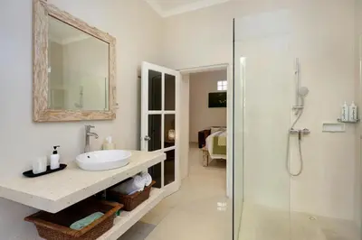 a bathroom with a sink and a shower at Villa Alba in Seminyak