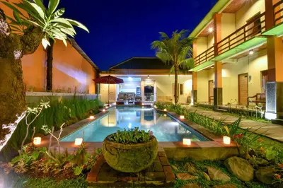 a swimming pool in the middle of a house at The Rani Garden Bed & Breakfast in Denpasar