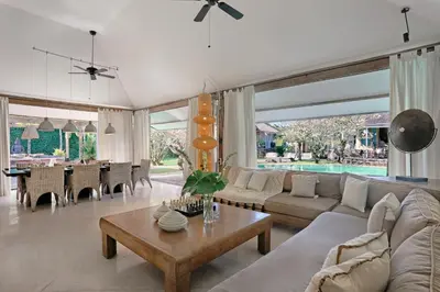 a living room with a couch and a table at Maya Villa - Seminyak in Seminyak