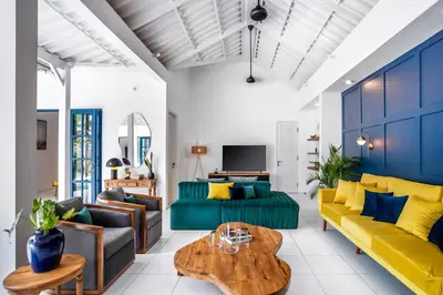 a living room with a couch and a table at The Beach House in Canggu