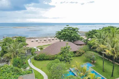 an aerial view of a resort with a beach at Tijili Hotel Benoa in Nusa Dua