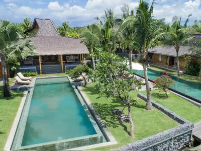 an aerial view of a villa with a swimming pool at Mannao Estate by Villa Finder in Kerobokan