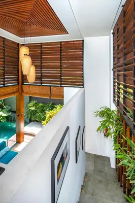 a staircase in a house with a swimming pool at S18 Bali Villas in Legian