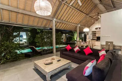 a living room with a couch and a table at VILLA Nuri Merah 1 in Kerobokan