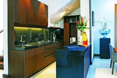 a kitchen with a sink and a counter top at Kanishka Villas in Seminyak