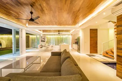 a living room with a couch and a ceiling at Villa Kamag Seminyak in Seminyak