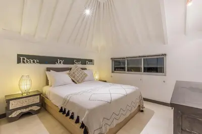 a bedroom with a bed and a window at Villa Irma in Seminyak