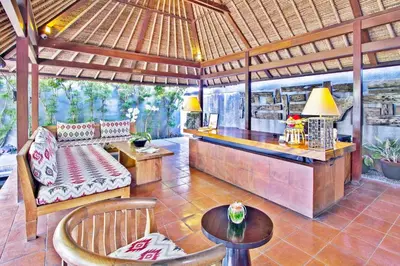 a living room with a bar in a pavilion at Mayaloka Villas Seminyak in Seminyak