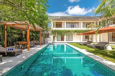 an image of a swimming pool in front of a house at Villa Seriska Jimbaran - Spacious 5BR Private Pool Villa with Private Cook, Spa & Tour in Jimbaran