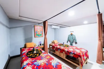 a room with two beds in a room at Stark Boutique Hotel and Spa in Kuta