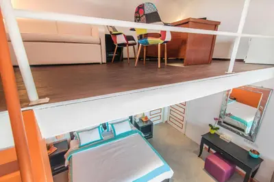 a doll house with a bed and a desk at Villa Majorelle Bali in Seminyak