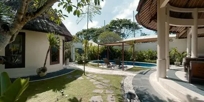 a house with a swimming pool in a yard at Aruni Bali Jimbaran Boutique Villa in Jimbaran