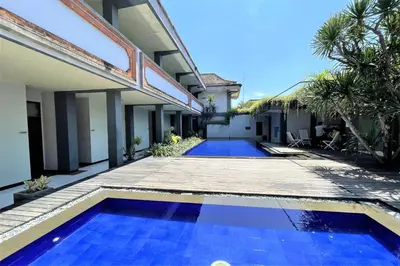 a swimming pool in the backyard of a house at The Yani Hotel Bali in Denpasar