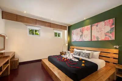 a bedroom with a large bed in a room at The Seiryu Boutique Bali Villas in Seminyak