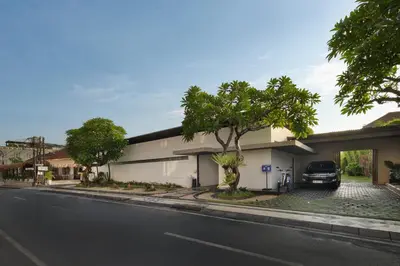 a car parked in front of a building on a street at The Seiryu Boutique Bali Villas in Seminyak