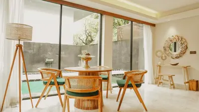 a dining room with a table and chairs at Annora Villas Seminyak in Seminyak