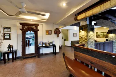 a restaurant with a bench and a mirror in a room at The Khayangan Dreams Villa, Seminyak in Seminyak