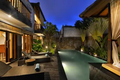 an outdoor swimming pool in a villa at The Khayangan Dreams Villa, Seminyak in Seminyak
