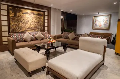 a living room with couches and a table at djabu Seminyak Hotel in Seminyak