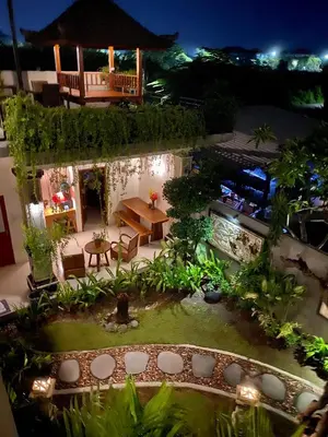 an aerial view of a garden at night at Dikubu Belong Seminyak in Seminyak