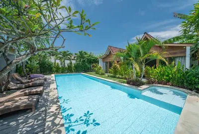 a swimming pool in the backyard of a villa at Villa Nahema - 4BR Villa in Seminyak Next to the Beach in Canggu
