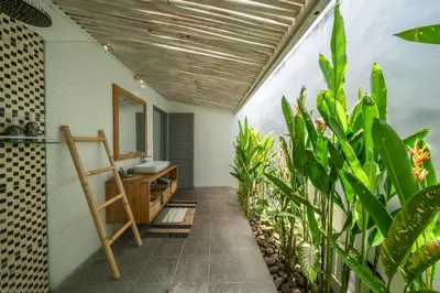 a bathroom with a sink and some plants at Villa Nahema - 4BR Villa in Seminyak Next to the Beach in Canggu