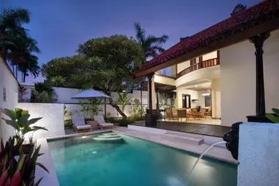a swimming pool in the backyard of a house at The Club Villas Seminyak in Seminyak