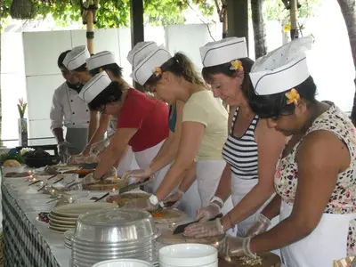 a group of women in chef hats preparing food at Jay's Villa Umalas in Canggu