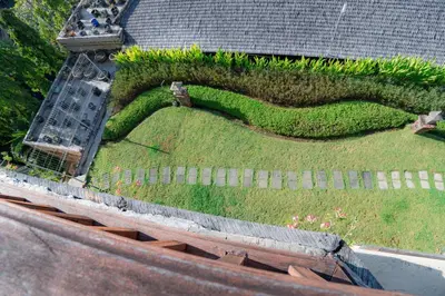 a garden on the roof of a house at Kuta Paradiso Hotel in Kuta