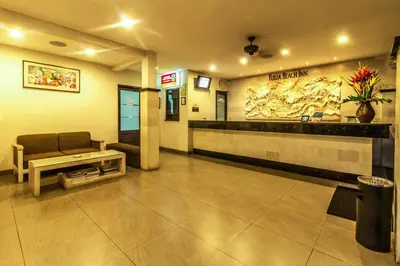 a lobby with a waiting room with a couch in it at Yulia Beach Inn Kuta in Kuta