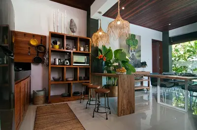 a kitchen with a table and a dining room at 3BR Villa Erja - Minggu Villas - Special Stay Bonus in Kerobokan
