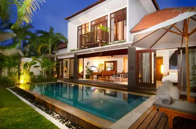 a villa with a swimming pool in front of a house at 3BR Villa Erja - Minggu Villas - Special Stay Bonus in Kerobokan