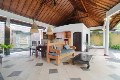 a living room with a couch and a table at Singgah Villas Seminyak in Seminyak