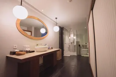 a bathroom with a sink and a mirror at Javana Royal Villas in Seminyak