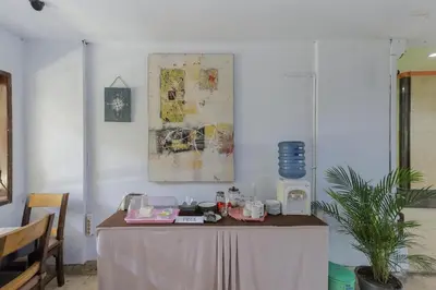 a table with a table cloth on it in a room at Urbanview Hotel Taman Suci Denpasar Bali in Denpasar